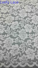 Full Width Stretch Lace Fabric In White, Adorned With Delicate Floral Patterns And Scalloped Edges Luxuriously