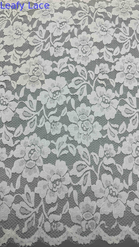 Full Width Stretch Lace Fabric In White, Adorned With Delicate Floral Patterns And Scalloped Edges Luxuriously